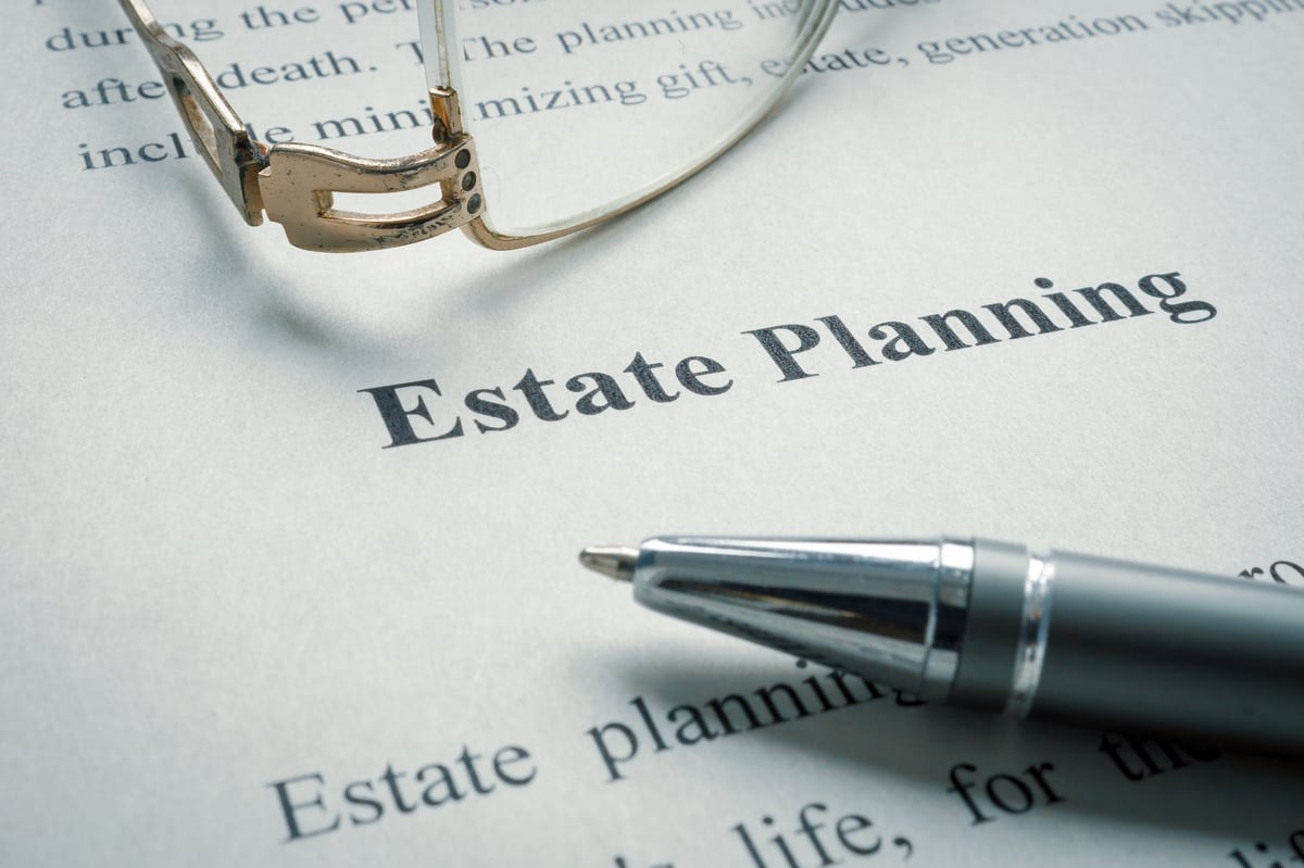 Estate planning documents and glasses